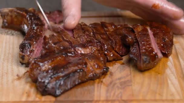 Cooking concept. Cutting meat stand on a wooden board - Filmagem, Vídeo