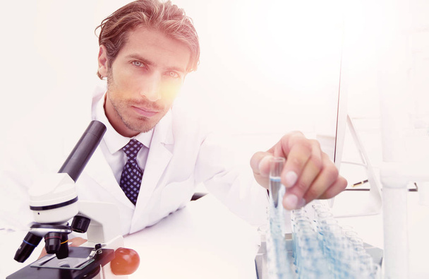laboratory scientist working in a laboratory with a microscope - Foto, imagen