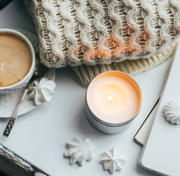 Cozy winter home interior with knitted blanket and candle - Photo, Image