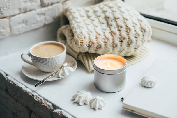Cozy winter home interior with knitted blanket and candle - Photo, Image