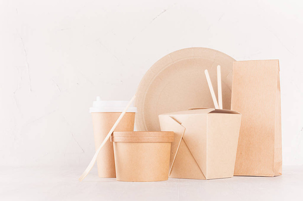 Eco friendly recycling paper packing for fast food, template for design, advertising and branding -  blank bag, cup, box, container, fork, plate on white wood board. - 写真・画像