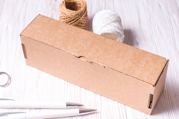 Cardboard box on wooden background - Foto, immagini