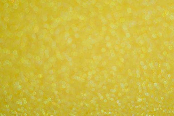 Abstract glitter yellow background for card and invitation - Foto, afbeelding