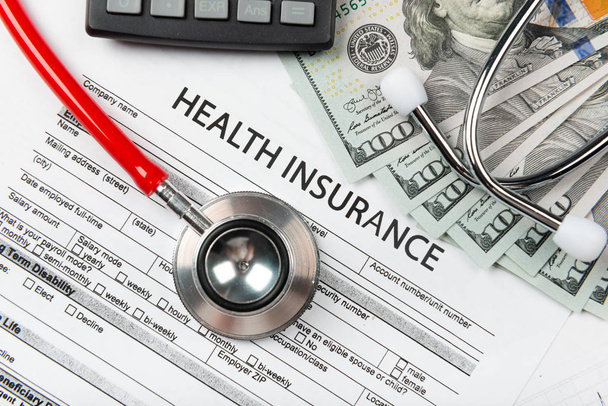 Stethoscope and calculator symbol for health care costs or medical insurance - Φωτογραφία, εικόνα