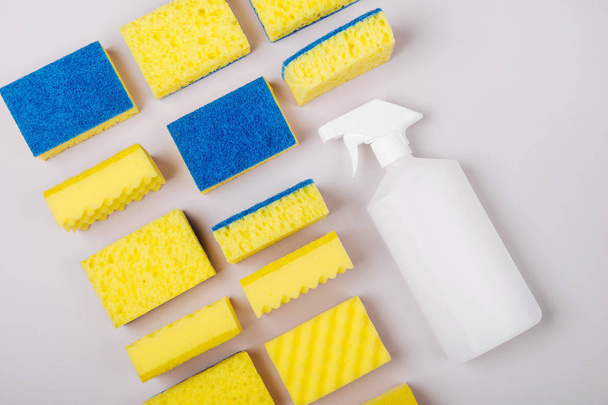 Sponges on gray background, cleaning or housekeeping concept  - Photo, Image