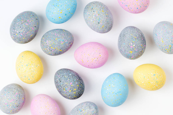Background with pale pink, blue, yellow and gray Easter eggs - Φωτογραφία, εικόνα