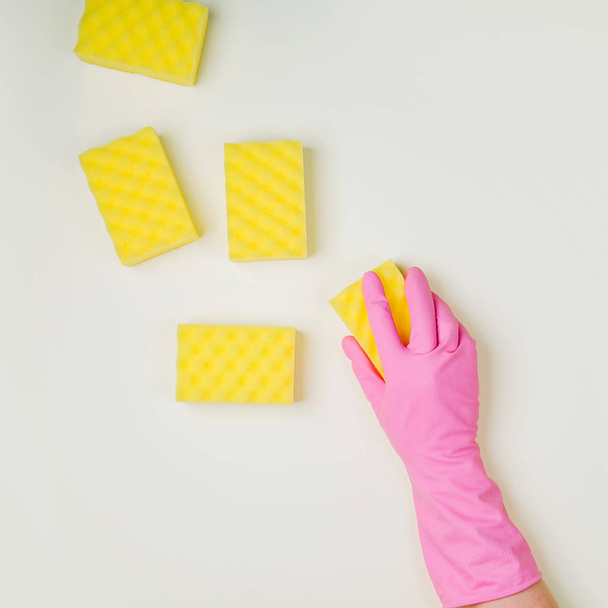 Female hand cleaning on light background - Foto, afbeelding