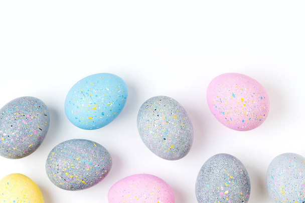 Background with pale pink, blue, yellow and gray Easter eggs - Φωτογραφία, εικόνα