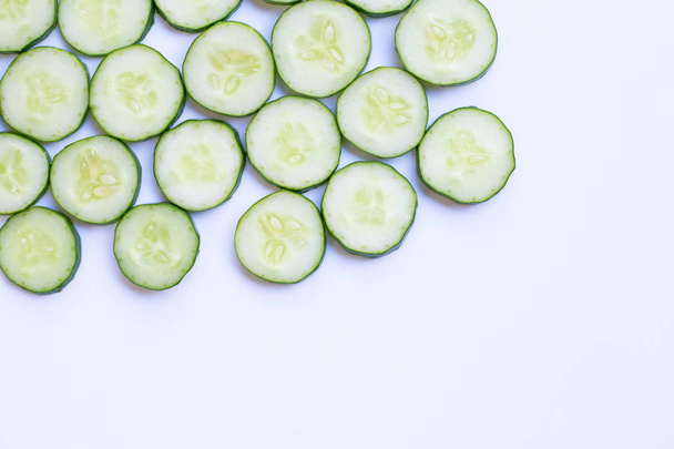Cucumber slices on white background. Copy space - Фото, изображение