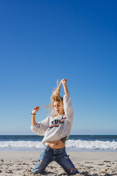 girl having fun on the beach, ocean, blue sky. - Φωτογραφία, εικόνα