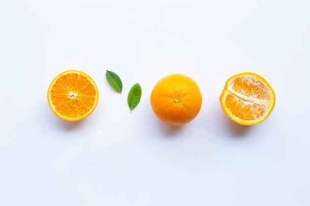 High vitamin C. Fresh orange citrus fruit with leaves isolated on white background. - Foto, immagini