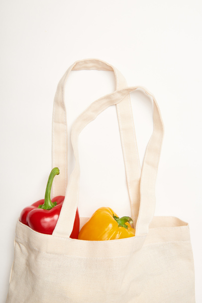 Studio shot of bell peppers in eco bag on white background - Photo, Image