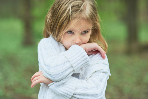 Portrait of sad unhappy little girl. Little sad child is lonesome. upset and distraught angry facial expression - Photo, image