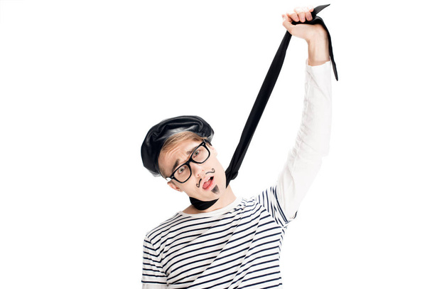 man in black beret and glasses pretending killing himself with scarf isolated on white  - Photo, Image