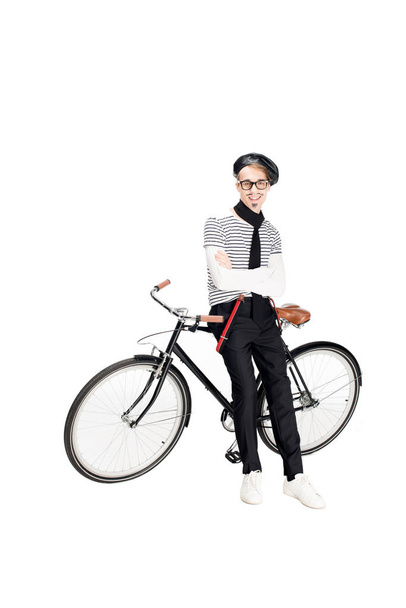 cheerful french man standing near bicycle isolated on white  - Zdjęcie, obraz