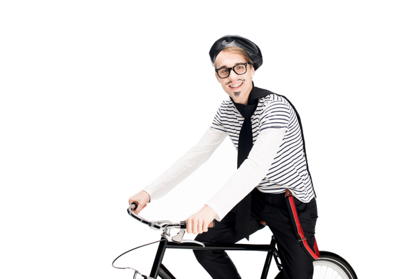 cheerful french man in glasses riding bicycle isolated on white  - Valokuva, kuva