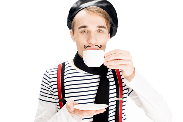 handsome parisian man drinking coffee isolated on white  - Foto, Bild