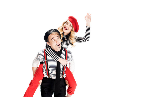 french man holding in arms happy girlfriend in red beret waving hand isolated on white  - Valokuva, kuva