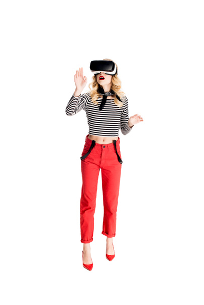 attractive woman in standing in virtual reality headset isolated on white  - Fotó, kép