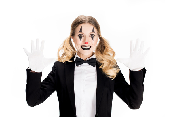 excited female clown smiling while showing white gloves isolated on white  - Fotó, kép
