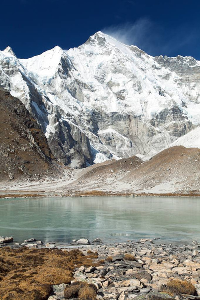 view of mount Cho Oyu mirroring in lake - Cho Oyu base camp - Everest trek - Nepal Himalayas mountains - Zdjęcie, obraz