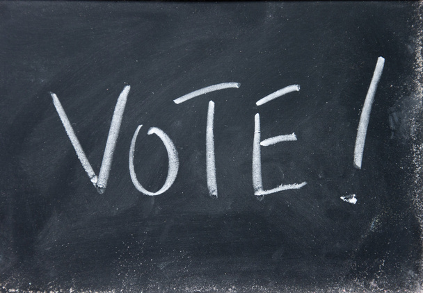 vote title written with chalk on blackboard - Фото, изображение