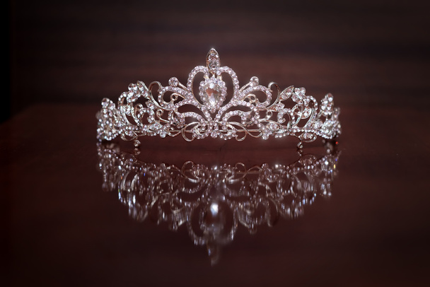 Luxury crown with gem stones on brown background  - Photo, Image