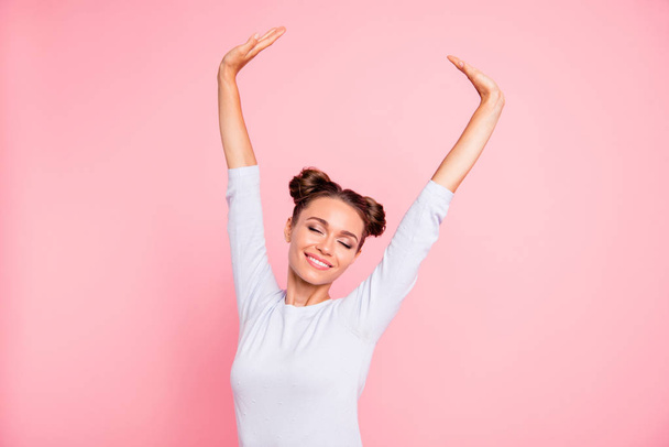 Close up photo of amazing attractive pretty she her lady with cute buns both hands pales up raised like bird wings very glad overjoyed wearing white pullover isolated on bright rose background - Photo, Image