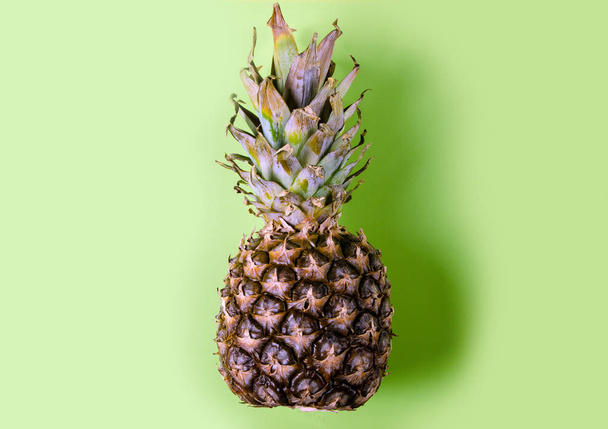 Pineapple fruit on green background - Фото, зображення