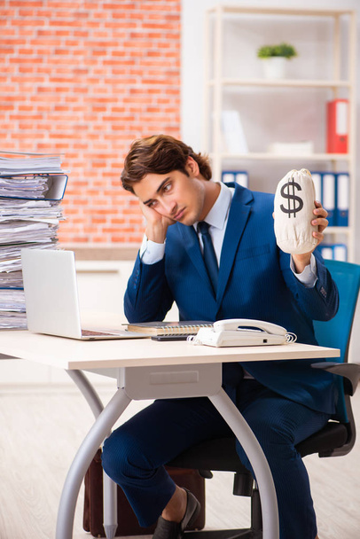 Young elegant man unhappy with too much work  - Photo, Image