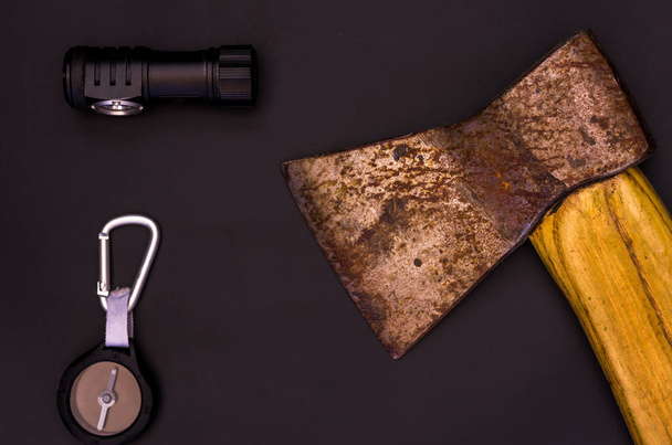 Ax, compass and flashlight. A set of forester. Flatlay - Zdjęcie, obraz