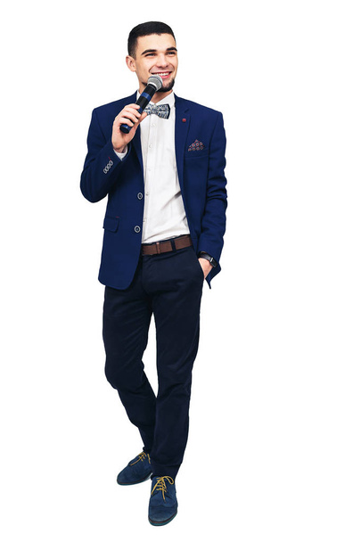 young stylish man with a microphone in his hand - Photo, Image