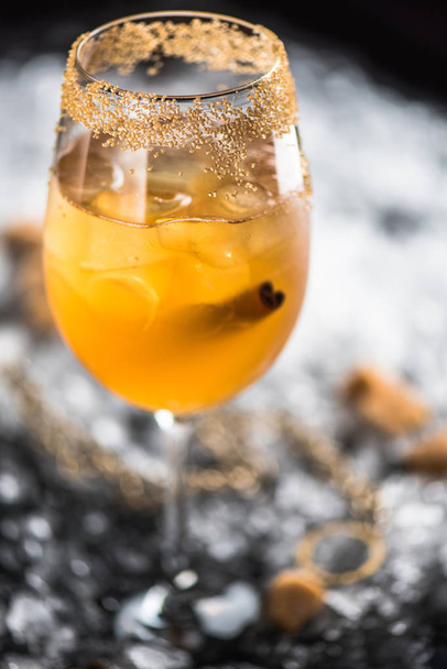 Cocktail with cinnamon on background with ice and brown sugar - Фото, зображення
