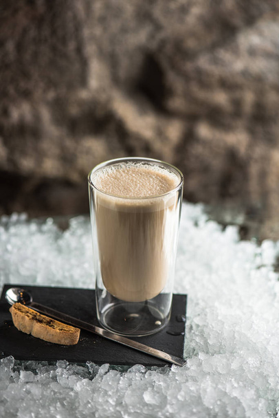 frappe coffee drink in glass served slate with biscotti on ice - Фото, изображение