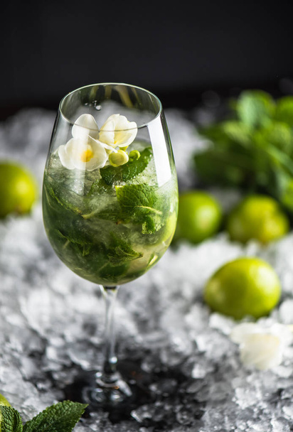 mojito cocktail in glass on ice with ingredients - Photo, image