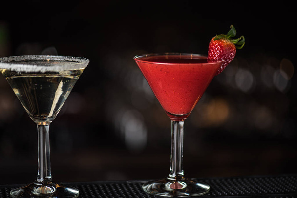 Cocktails in glasses on dark blurred background - Photo, Image