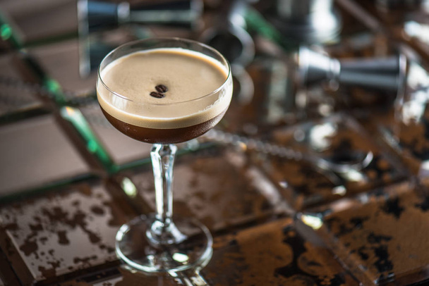 Cocktail in glass on brown tiled background - Foto, Imagem