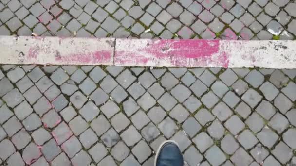 Top view a man walking on urban pathway with cobblestones - Footage, Video