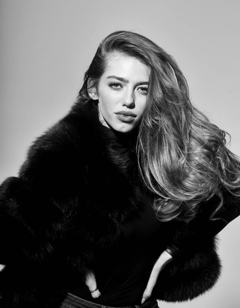 pretty sexy woman or girl with long hair in fur - 写真・画像