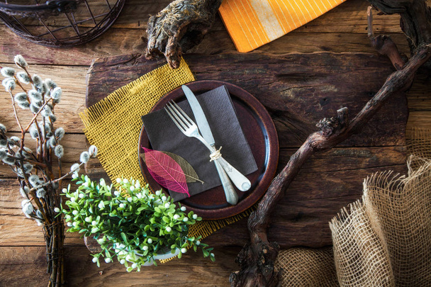 Spring table setting. Cutlery on wood. Fork and knife in plate. Flatlay overhead shot - Fotoğraf, Görsel