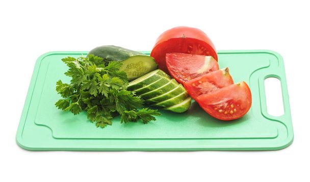 Fresh farmers garden vegetables cooking on the board on a white background. - Photo, Image