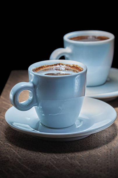 two coffee cups  with espresso on vintage wood board - Fotografie, Obrázek