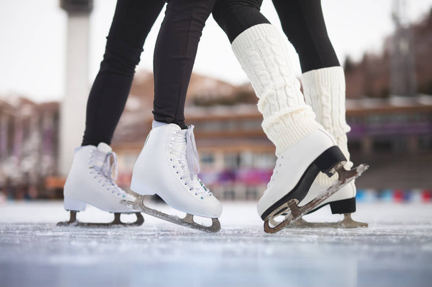 Closeup skating shoes ice skating outdoor at ice rink - 写真・画像