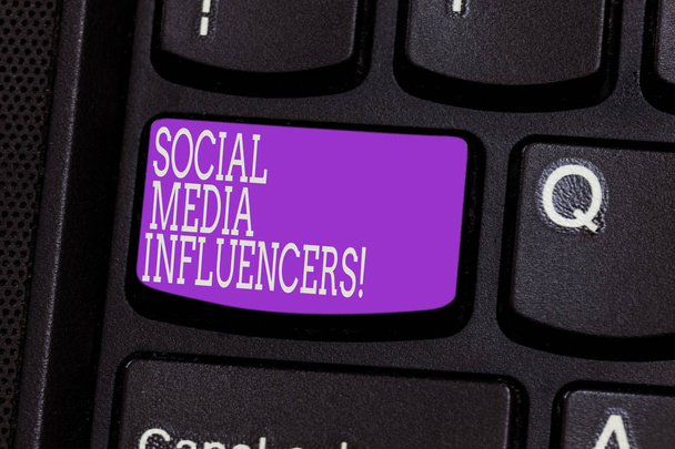 Conceptual hand writing showing Social Media Influencers. Business photo showcasing showing who have a reputation for their knowledge Keyboard key Intention to create computer message idea. - Photo, Image