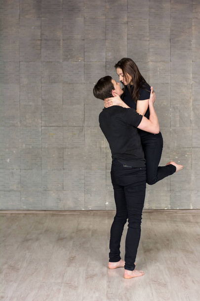 Guy holding woman in dance. - Φωτογραφία, εικόνα