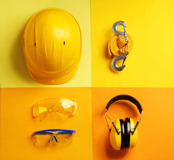 Flat lay composition with safety equipment on color background - Valokuva, kuva