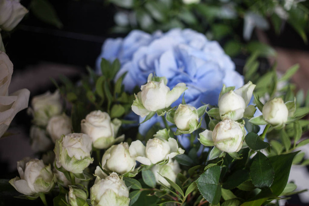 light blue hydrangea and white roses. The bride's bouquet. Mother's Day and March 8th. flower shop showcase and women's holidays concept - Фото, изображение