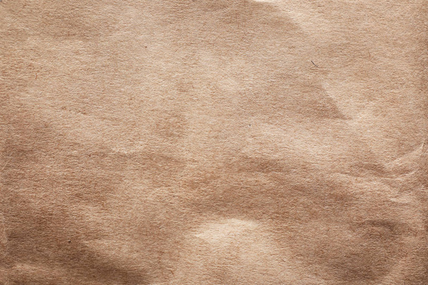 Brown paper bag texture as background, top view - Photo, Image