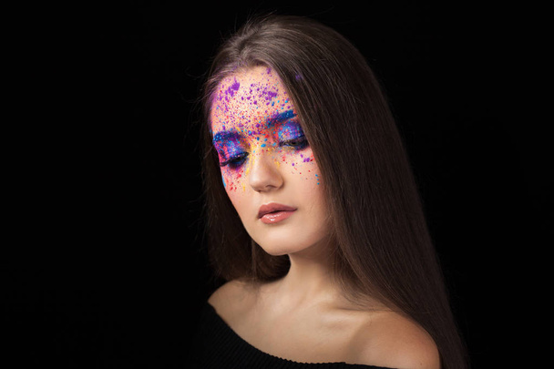 Attractive brunette with bright art make-up. Colored Smokey eyes and blue eyebrows. - Zdjęcie, obraz