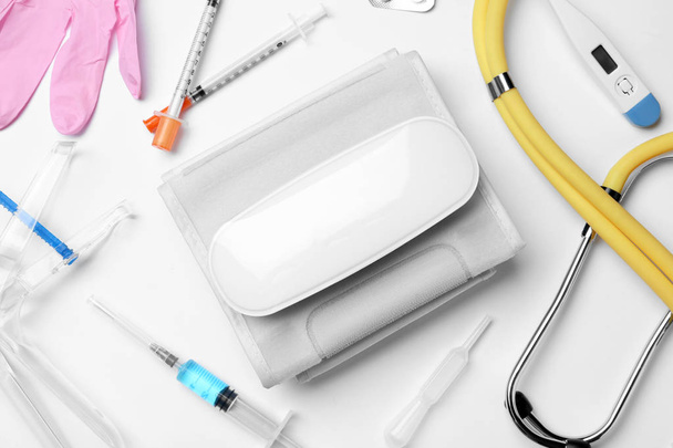 Flat lay composition with different medical objects on white background - Valokuva, kuva